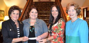 The Three Ten Club was able to make a monetary donation to the Faith House this month. On hand for the check presentation were, from left, Three Ten member Helen Zaunbrecher; Tricia Jones, Faith House children’s advocate; Katherine Monroe, Faith House women’s advocate; and Isabella delaHoussaye, Three Ten member.