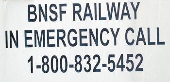 The emergency phone number for Burlington Northern Santa Fe Railway Company is placed at several locations along the railroad track which runs parallel to U.S. Hwy. 90 through Crowley. When the Post-Signal tried to contact them using this number, our calls went unanswered. 