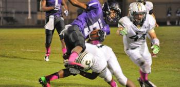 Crowley’s Curtis Broxton upends LaGrange’s Jaylun Myles last week during the Gents’ 52-27 loss to the Gators. Crowley will play host to Rayne this evening at Gardiner Memorial Stadium. Kickoff is slated for 7 o’clock.