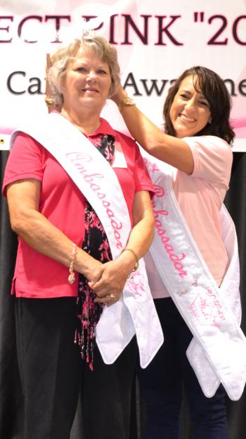 Janet Boudreaux is crowned the 2013-2014 Project Pink Ambassador Sunday during the 2013 Annual Project Pink held at the Rayne Civic Center by last year's honoree, Becky LaFleur.