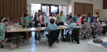 Contestants line up to check in their dishes at last year’s Rice and Creole Cookery Contest.