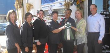 First National Bank took first place honors in the business category of Crowley Garden Club’s IRF Door Decorating Contest. On hand for the award presentation were bank employees Delilah Cormier, Mildred Miller, Sharisee Schwinn, Sherald Landry and Geralyn Stevenson; Crowley Garden Club member Patti Lawrence; and Randy Prather, bank president.