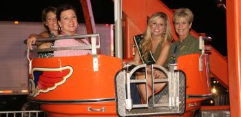 Enjoying a carnival ride are, from left, Karen Perry, 77th IRF Festival President Romona Credeur, 77th IRF Queen Sarah Mouton and Suzy Webb.