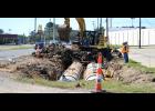 Department of Transportation and Development workers bury a dual culvert underneath the side of westbound lane of Oddfellows Road. The culverts will be paved over to create a turn lane for drivers headed north on Parkerson Avenue/Hwy. 13.