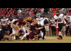 A host of Iota Bulldogs defenders go for a tackle behind the line of scrimmage against Welsh last week.